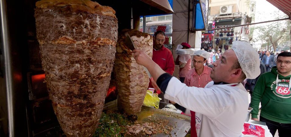 a-chef-cutting-one-of-egyptian-food-kings-shawarma