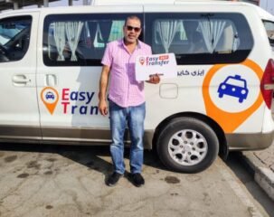 our driver with our sign in front of our van