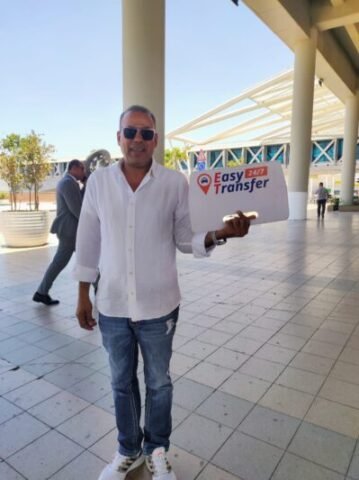 our driver holding our sign at the airport