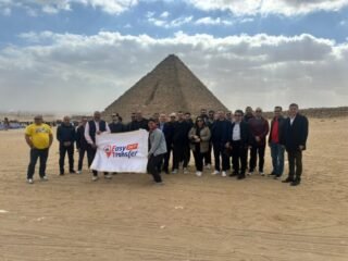 turkish group with our flag in front of pyramids