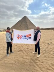 holding easytransfer flag in front of pyramids